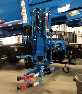 gripper arm on garbage truck receiving auto lube to 27 grease points