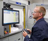 Man operating Unixact automated adhesive dispenser